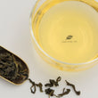 Load image into Gallery viewer, Hwa Gung Tea Legends Series Jade WenShan Pouchong Tea tea soup and strip shaped loose tea leaves