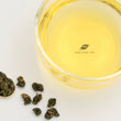 Load image into Gallery viewer, Hwa Gung Tea Legends Series Sun-Link-Sea Alpine Oolong Tea tea soup and ball shaped loose tea leaves