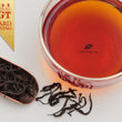 Load image into Gallery viewer, Hwa Gung Tea's award winning Legends Series Sun-Moon-Lake Ruby Black Tea tea soup and strip shaped loose tea leaves