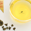 Load image into Gallery viewer, Hwa Gung Tea's award winning Legends Series Taiwan Alpine Oolong Tea tea soup and ball shaped loose tea leaves