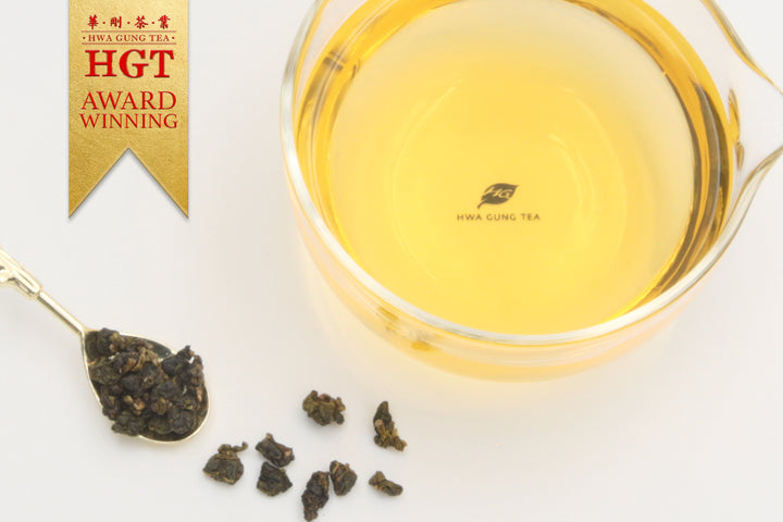  Hwa Gung Tea's award winning Eternity Series Reserved LiShan Alpine Oolong Tea tea soup and ball shaped loose tea leaves