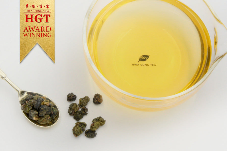 Hwa Gung Tea's award winning Eternity Series Reserved Snow Alpine Oolong Tea (1968) tea soup and ball shaped loose tea leaves