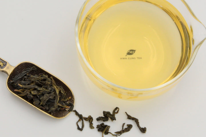 Hwa Gung Tea Legends Series Jade WenShan Pouchong Tea tea soup and strip shaped loose tea leaves