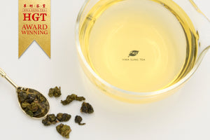 Hwa Gung Tea's award winning Legends Series LiShan Estate Oolong Tea soup and ball shaped loose tea leaves