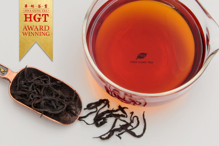 Hwa Gung Tea's award winning Legends Series Sun-Moon-Lake Ruby Black Tea tea soup and strip shaped loose tea leaves