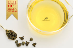 Hwa Gung Tea's award winning Legends Series Taiwan Alpine Oolong Tea tea soup and ball shaped loose tea leaves